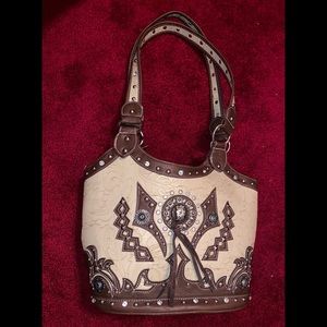 Cowgirl Trendy purse.🌼